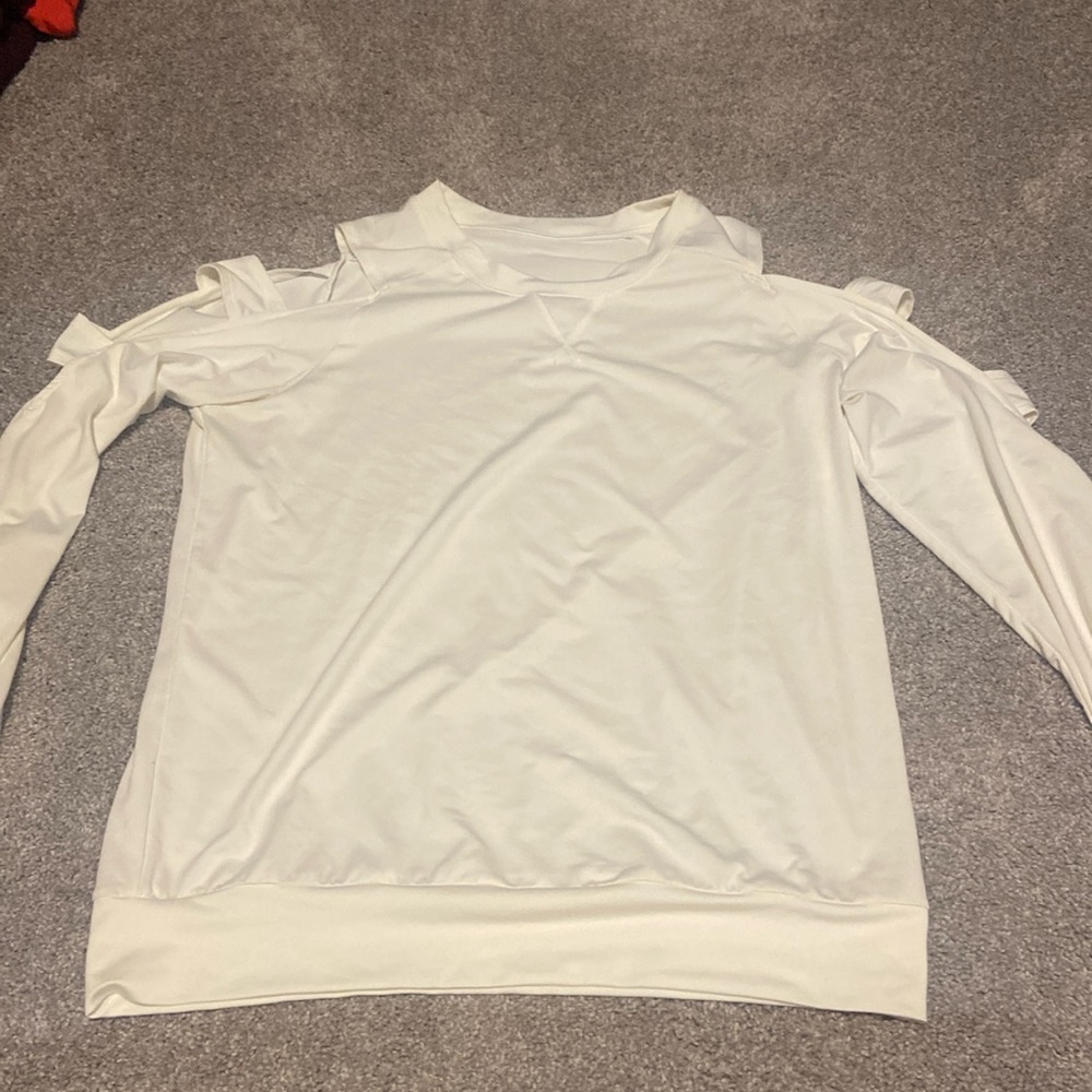 Born Primitive cream colored top. Size medium.